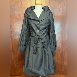 Spanner belted jacket and skirt for formal evening or cocktail parties.